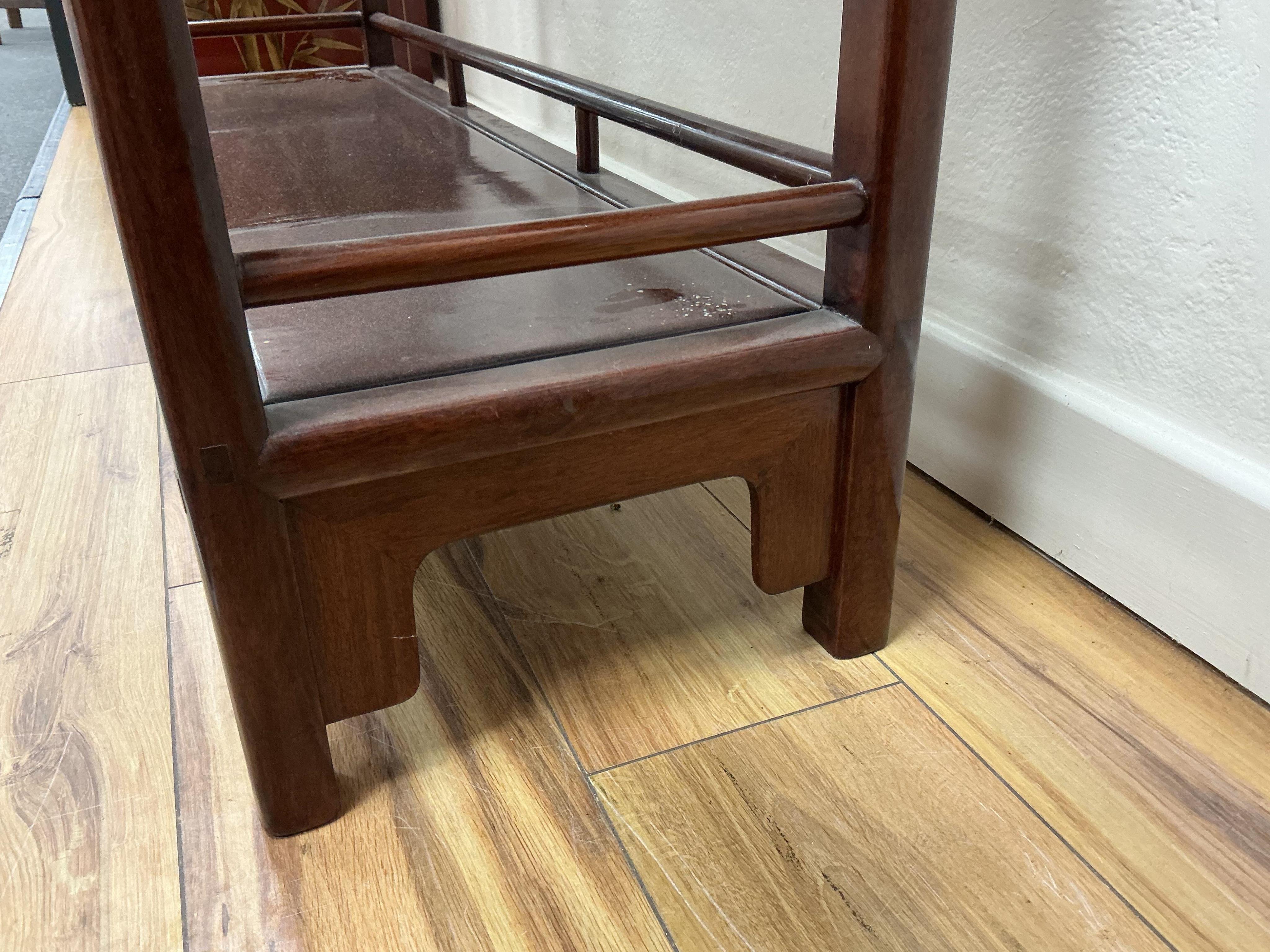 A Chinese hardwood open bookcase, width 100cm, depth 30cm, height 195cm